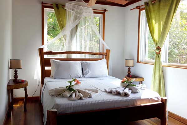 First bedroom with a double bed and two small bedside tables, each with a lamp